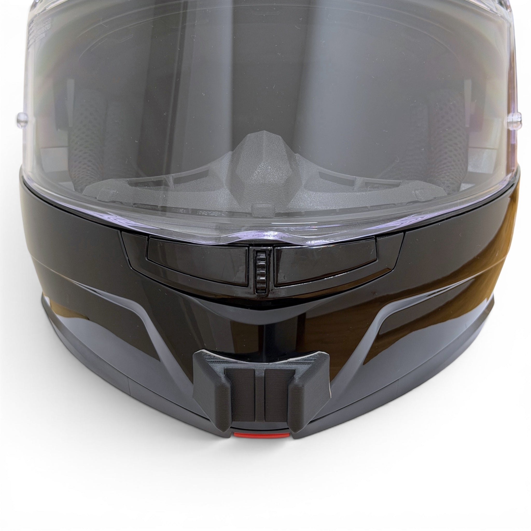 Vista frontal del casco LS2 STROBE 2 con el soporte de mentonera RiderMounts montado
