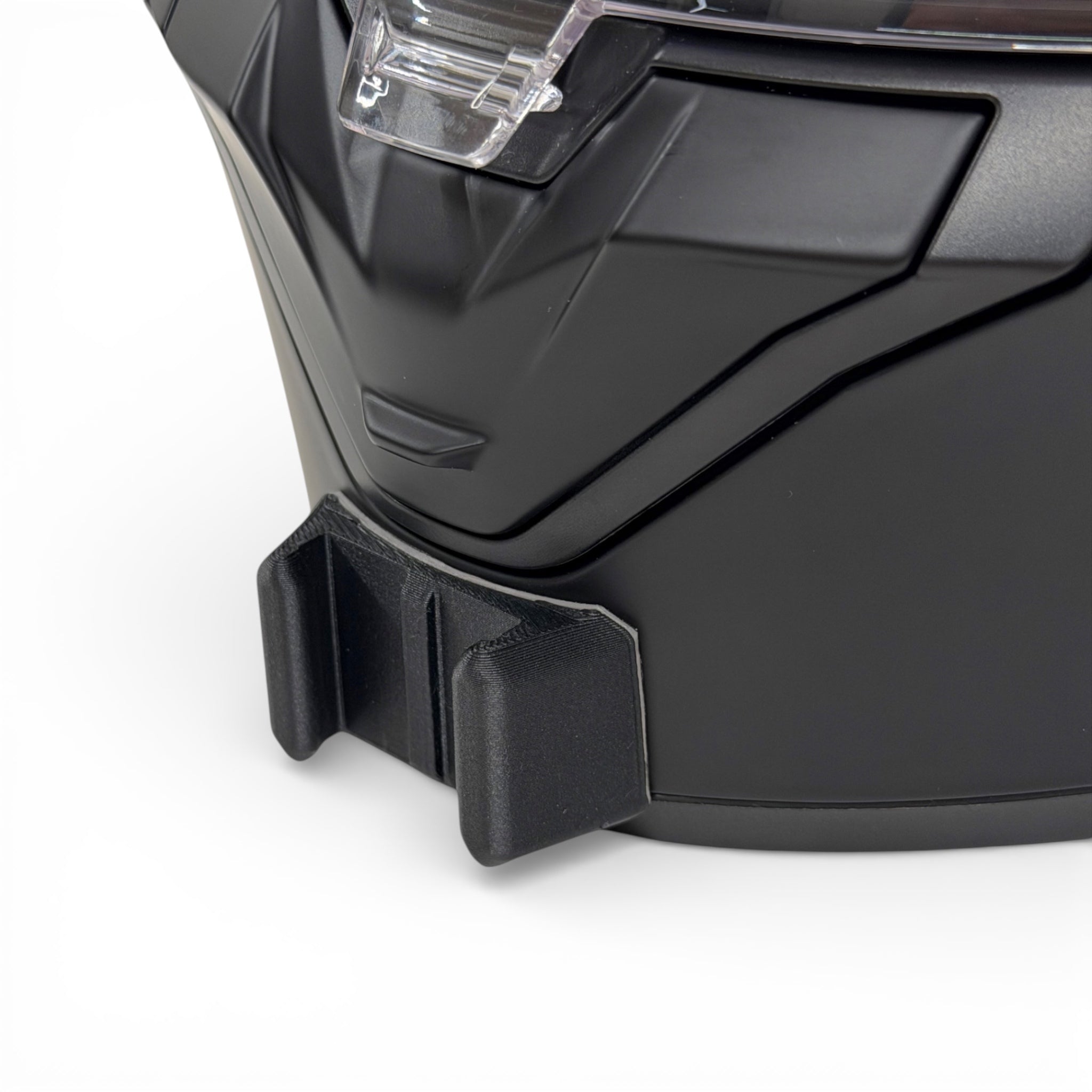 Primer plano del soporte de mentonera RiderMounts en la barbilla del casco SHARK RIDILL 2